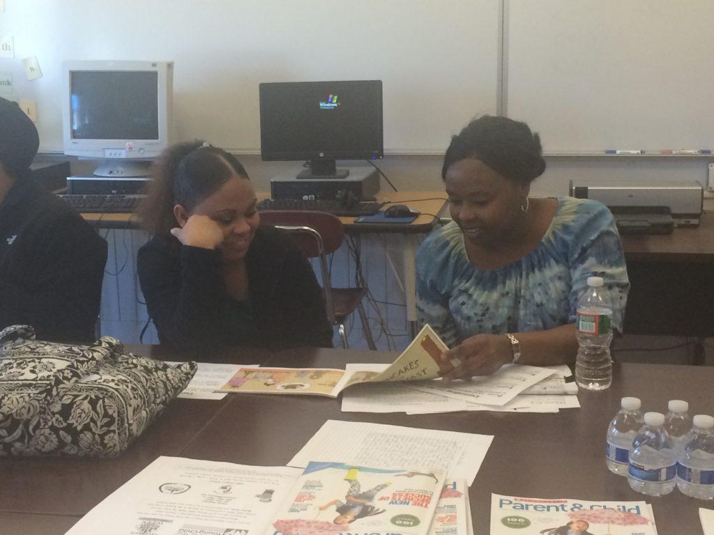 Parent practicing dialogic reading at a Raising A Reader MA workshop.